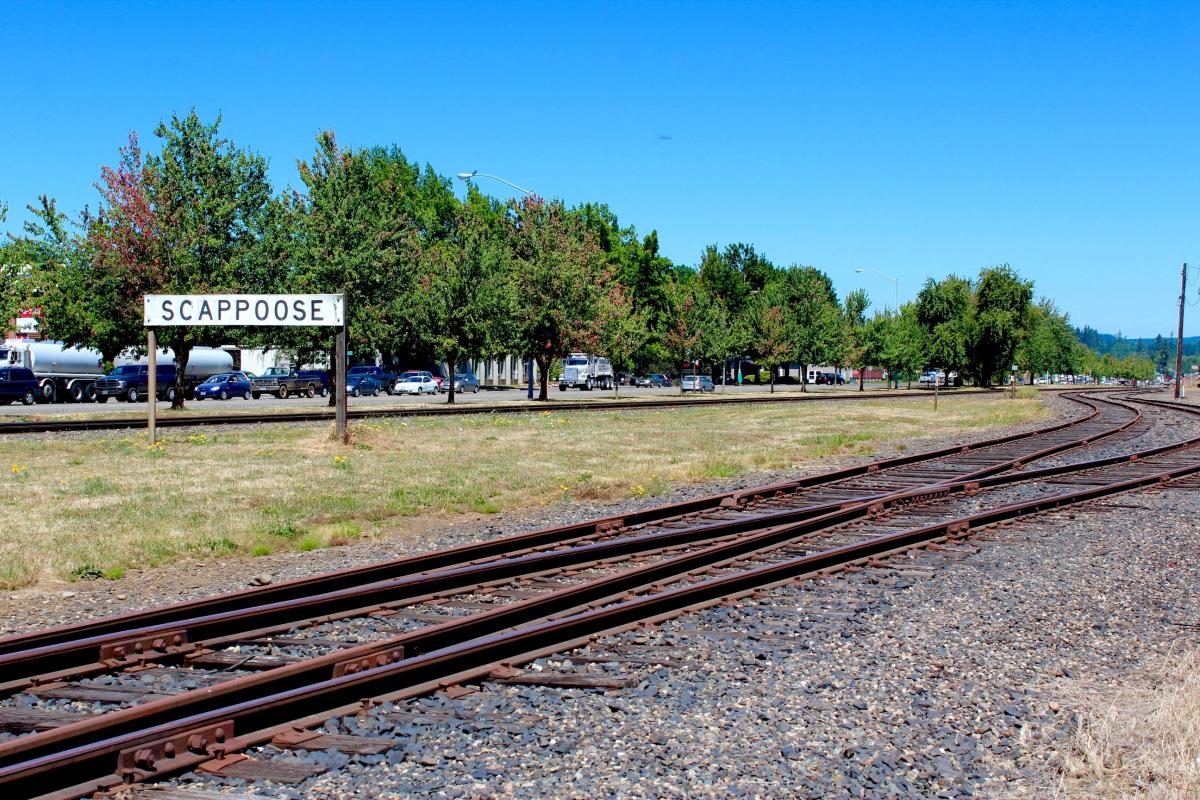 Scappoose Sign with Tracks